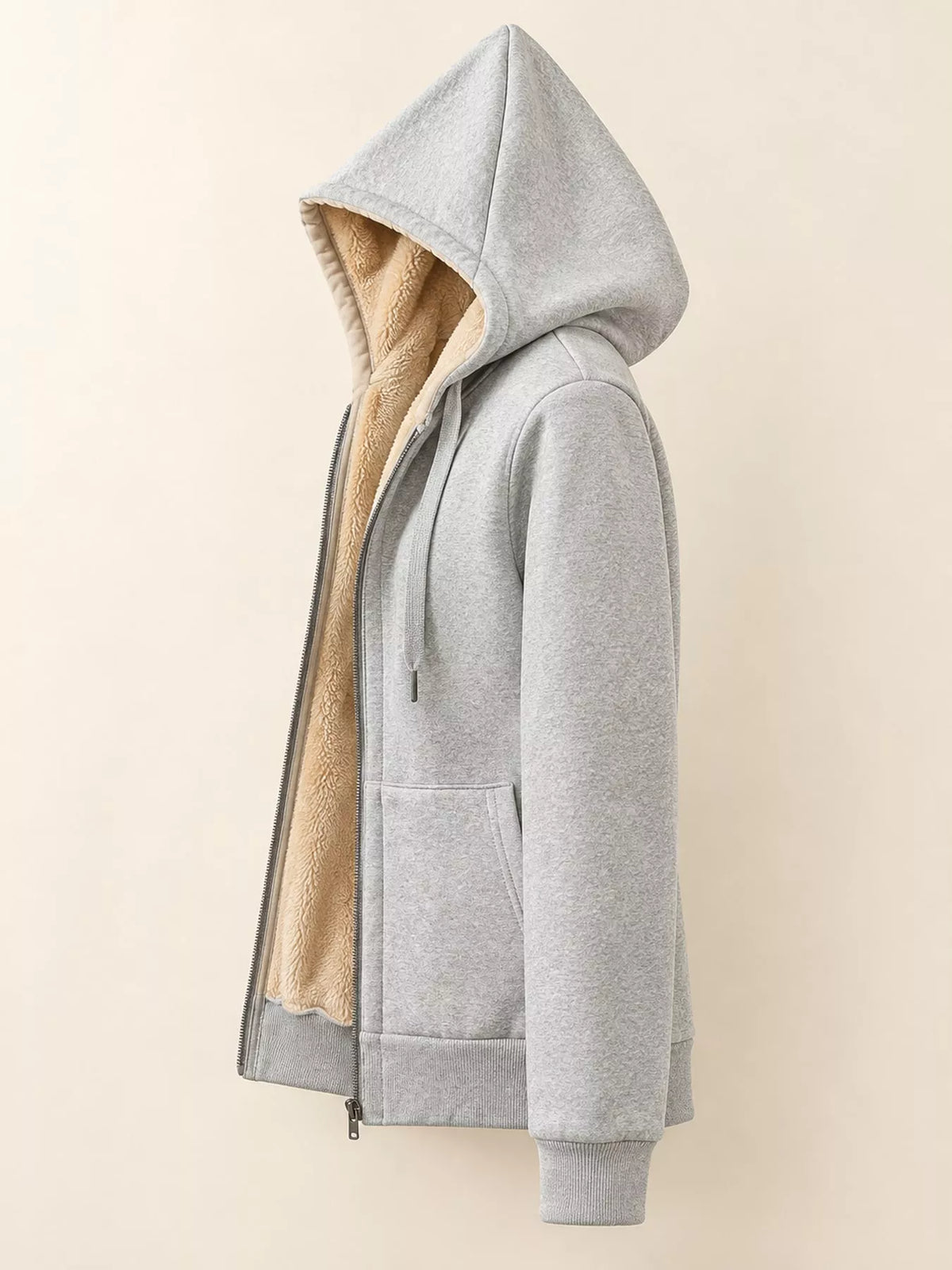 A light gray zip-up hoodie with a soft beige sherpa lining, shown in a side profile view against a solid light beige background.