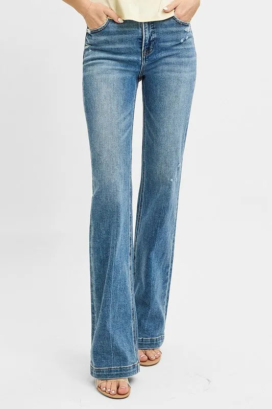 Blue jeans worn by a person on a white background