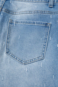 Close-up of a blue denim pocket with visible stitching