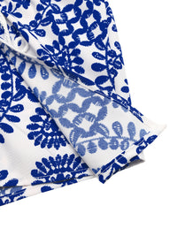 Blue and white patterned fabric on a white background