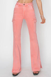 Pink flared jeans worn by a person on a white background