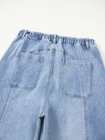 Light blue denim pants with a white background