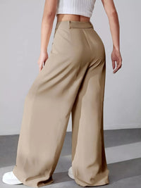 Beige wide-leg pants worn by a person on a plain background