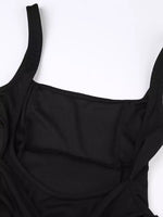 Black swimsuit top on a white background