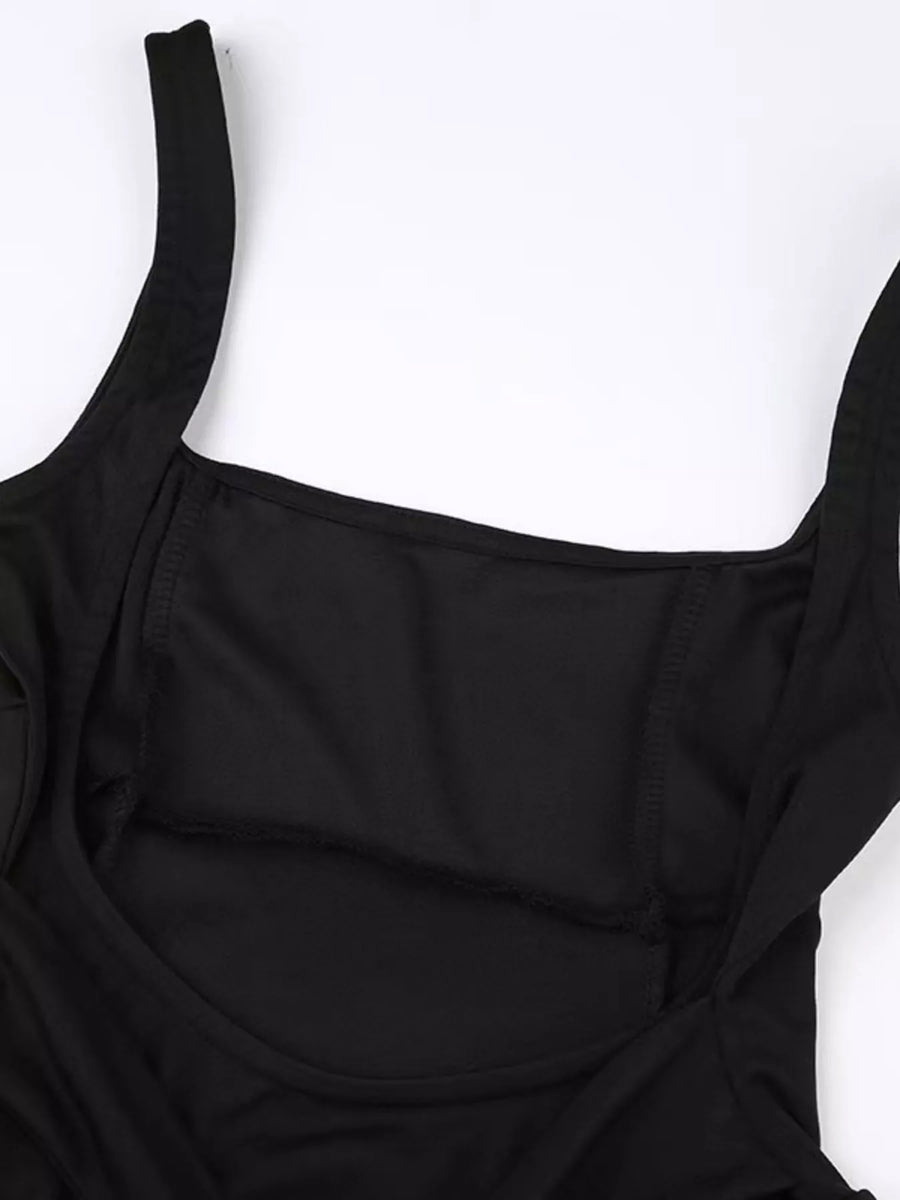 Black swimsuit top on a white background