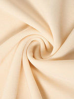 Close-up of beige fabric with folds