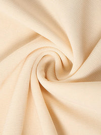 Close-up of beige fabric with folds
