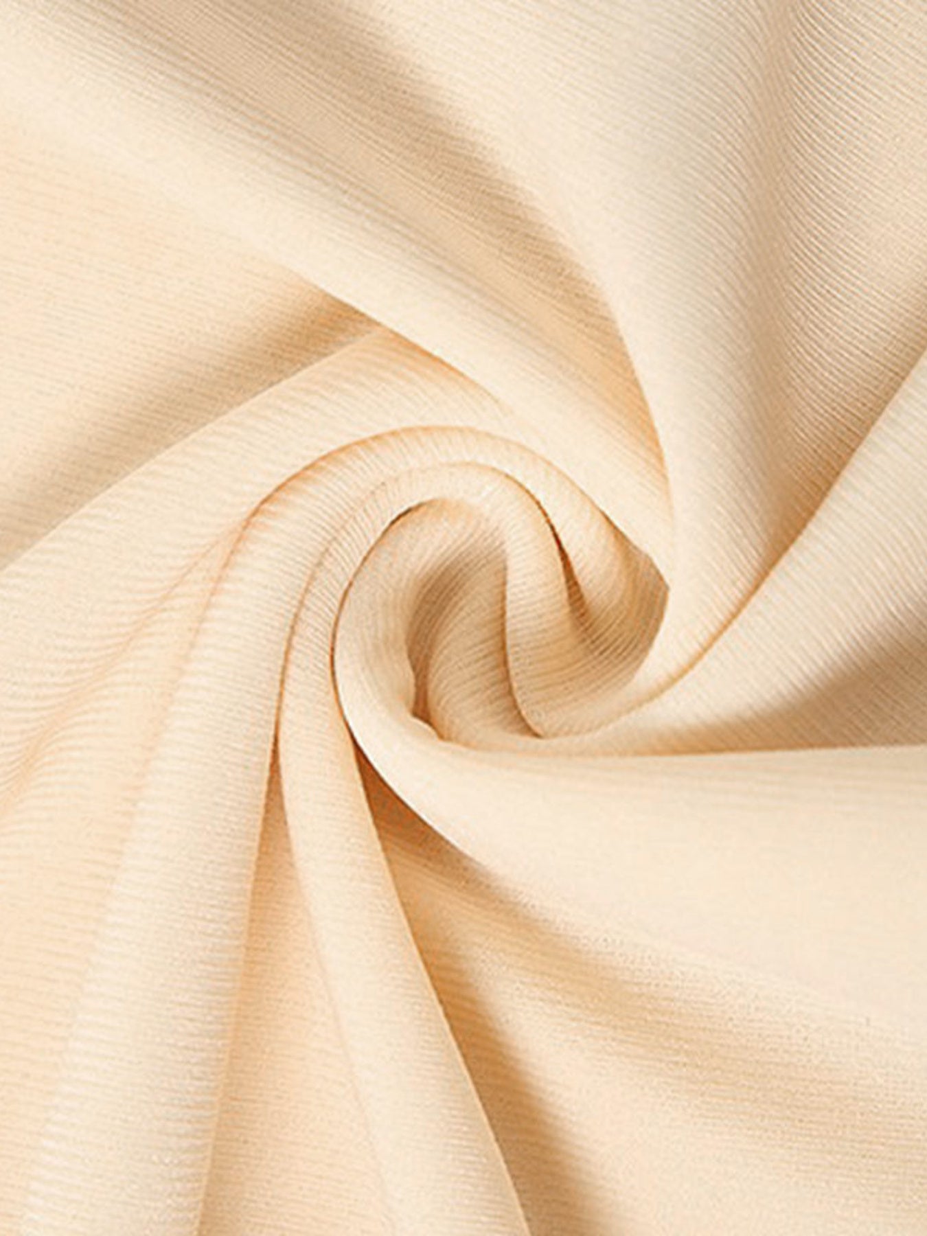 Close-up of beige fabric with folds