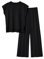 Black sleeveless top and wide-leg pants on a white background