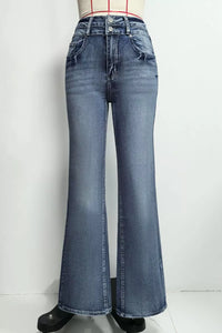 Blue flared jeans on a white background