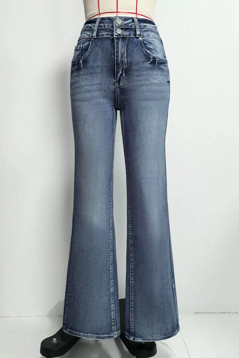 Blue flared jeans on a white background