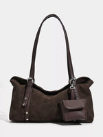Brown handbag with a smaller attached pouch on a white background