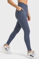 Person wearing blue leggings with a white background