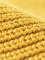 Close-up of textured yellow fabric