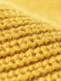 Close-up of textured yellow fabric