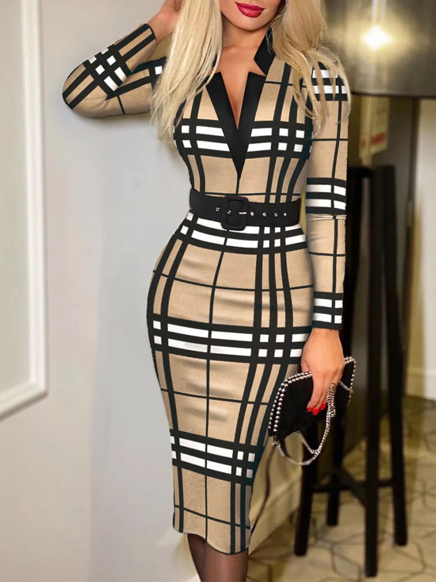 Woman wearing a checkered dress with a belt in an indoor setting