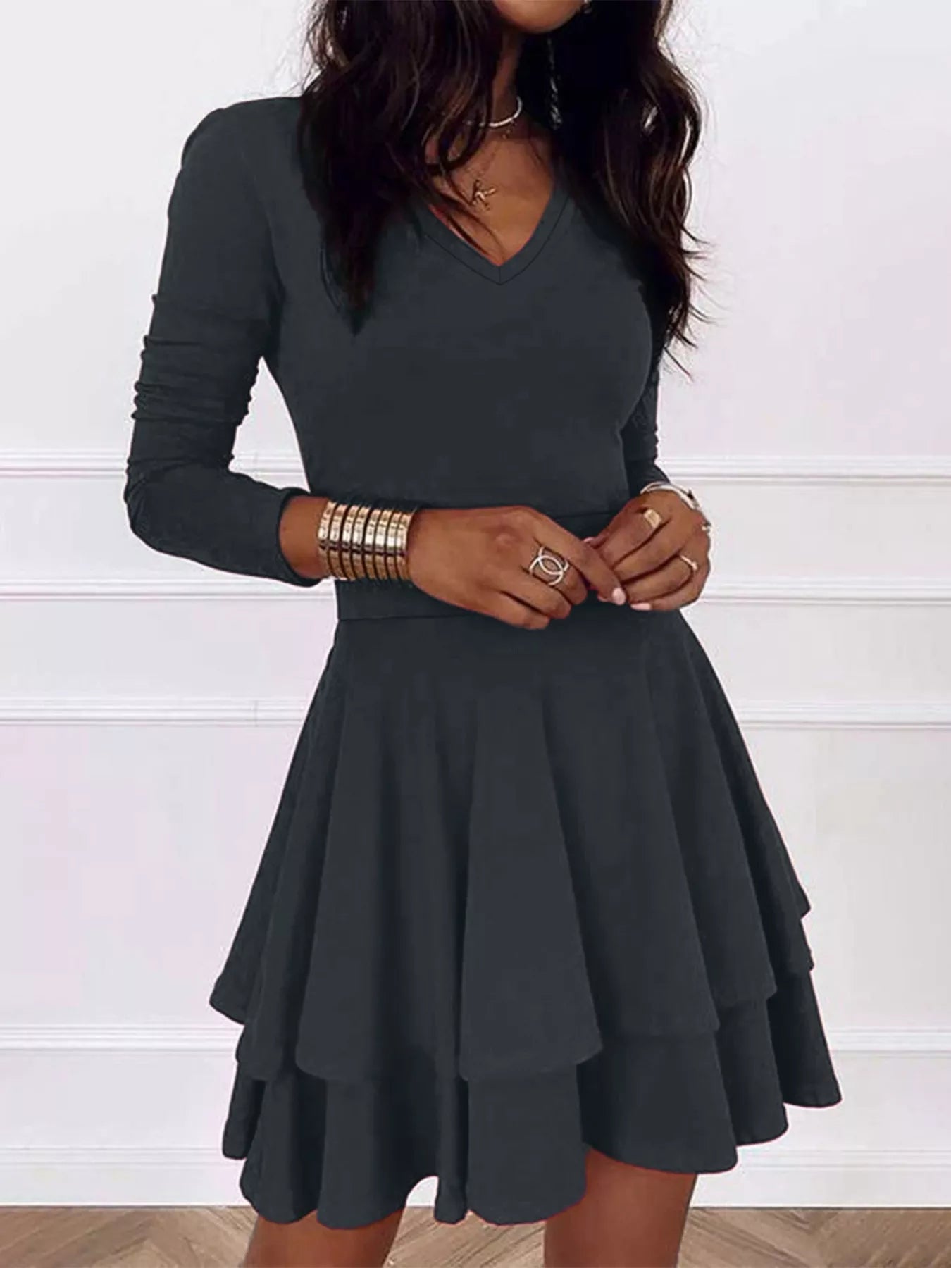 Black dress worn by a person on a white background