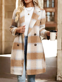 Woman wearing a plaid coat holding a coffee cup in an urban setting