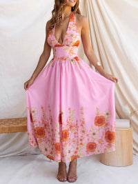 Woman wearing a pink floral dress against a white background
