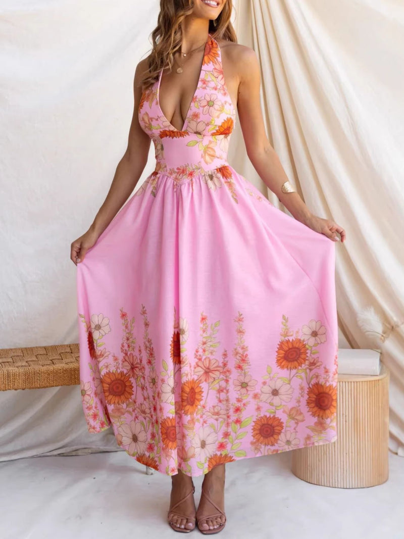 Woman wearing a pink floral dress against a white background