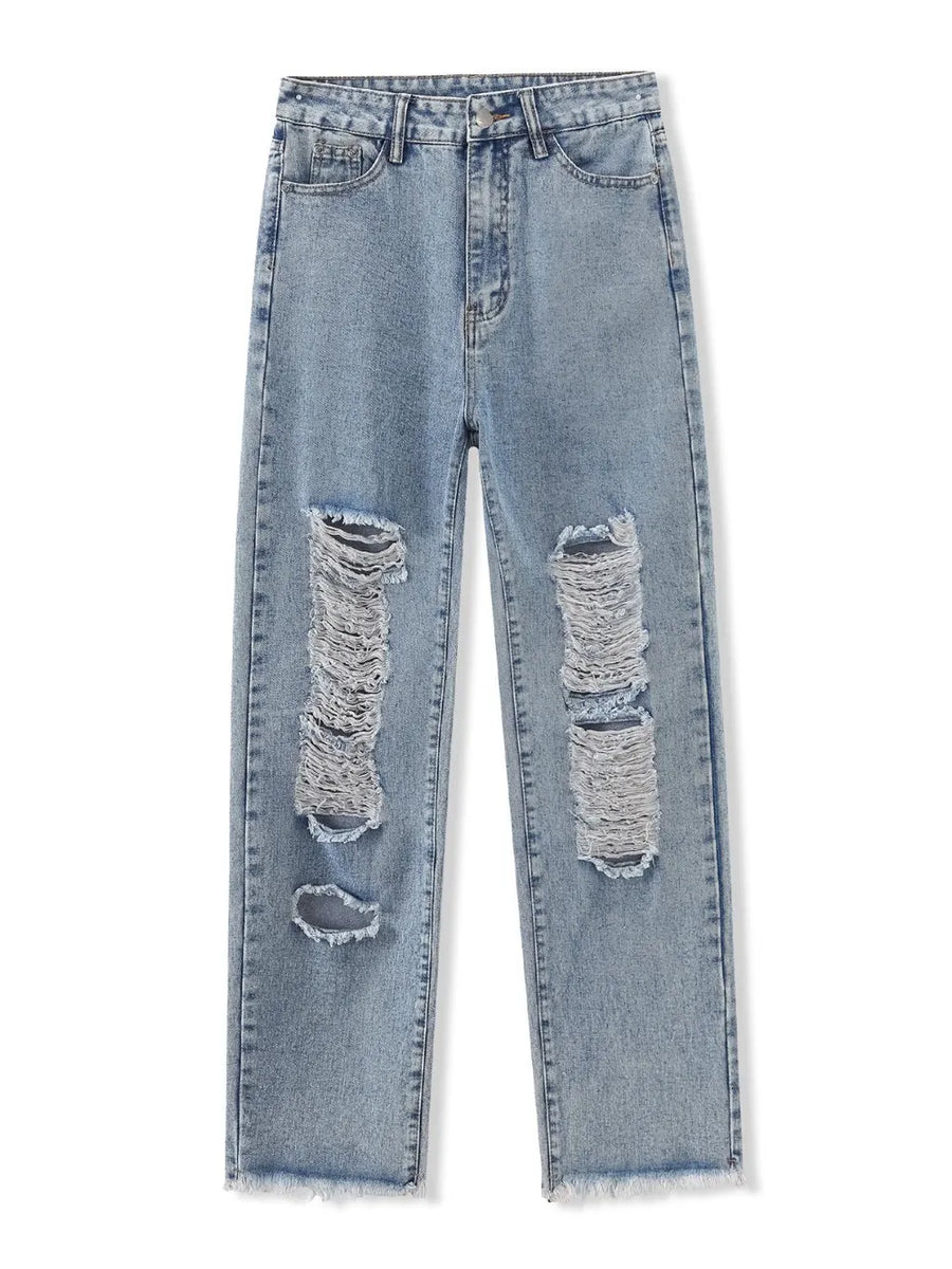 Ripped blue jeans on a white background