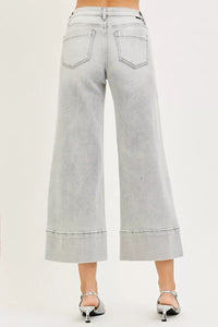 Light gray wide-leg jeans on a plain background