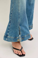 Close-up of blue jeans with a white background