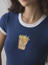 Blue t-shirt with a graphic of fries and a bag on a plain background