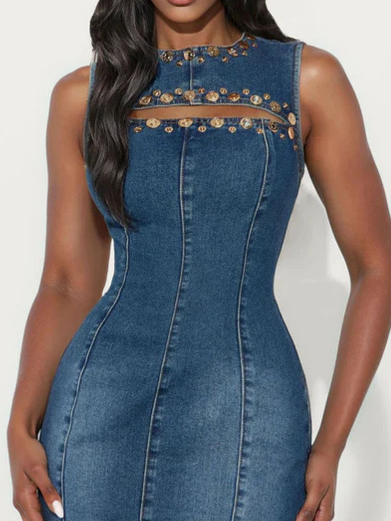 Blue denim dress with gold embellishments on a white background