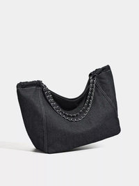 Black handbag with chain detail on a white background