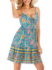 Woman wearing a colorful floral dress on a white background