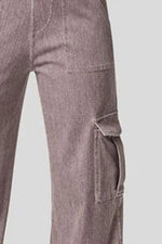 Close-up of gray cargo pants on a light gray background