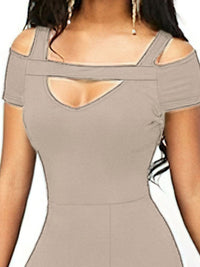 Beige dress with cut-out design on a white background