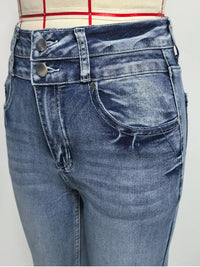 Close-up of blue jeans with a plain background