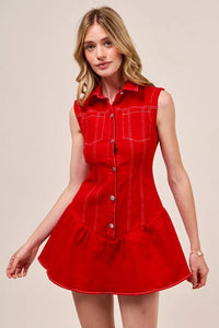 Woman wearing a red sleeveless dress against a beige background