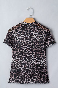 Leopard print dress on a hanger against a light gray background