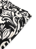 Black and white floral patterned fabric on a white background