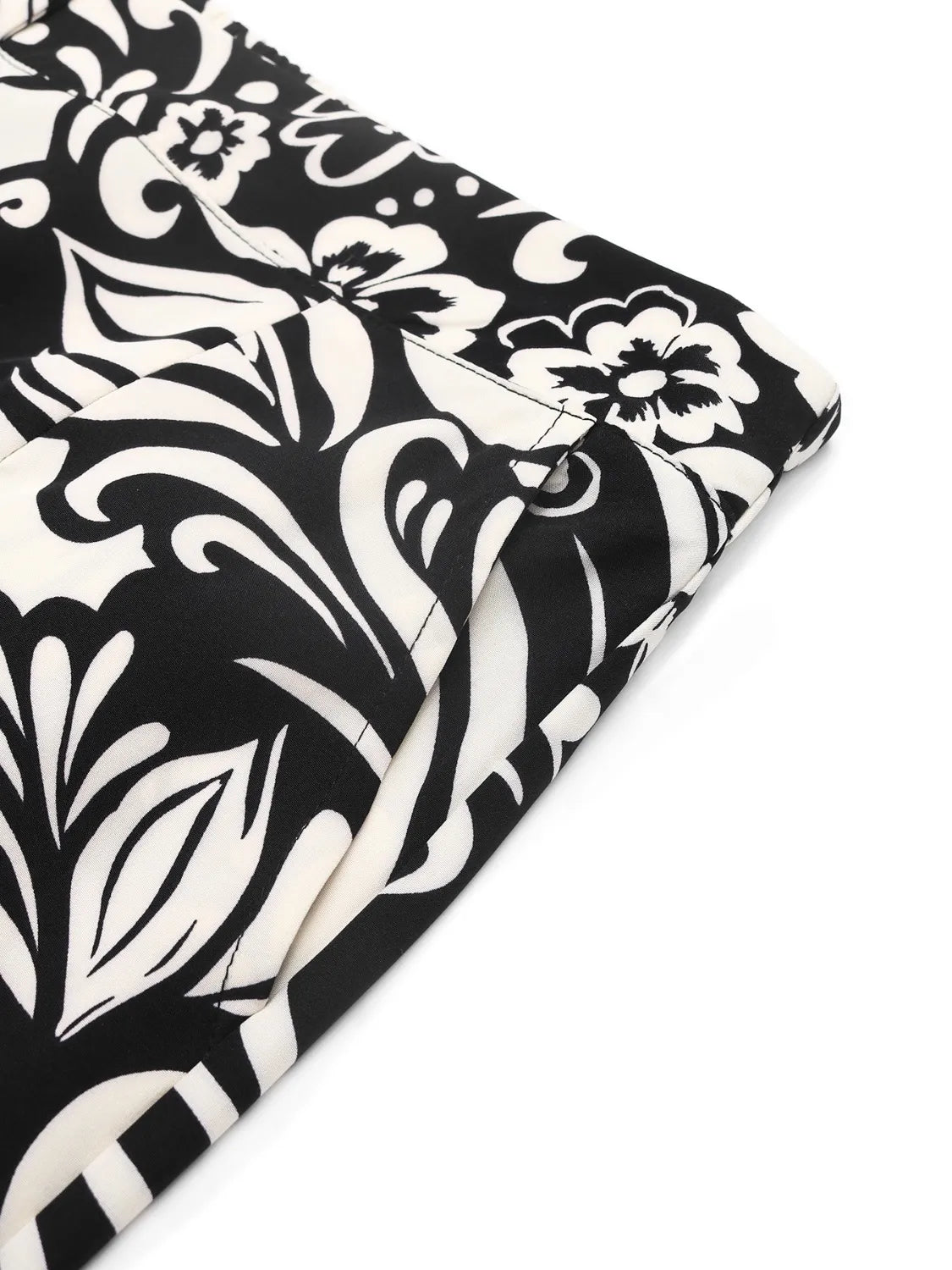 Black and white floral patterned fabric on a white background