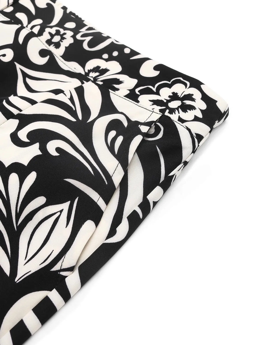 Black and white floral patterned fabric on a white background