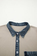 Beige shirt with denim collar and buttons on a light gray background
