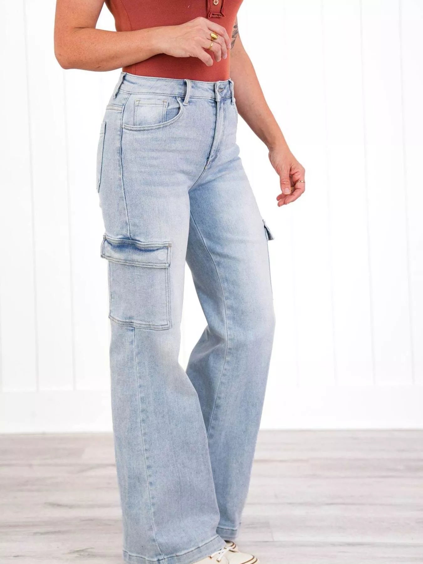 Light blue jeans worn by a person on a white background