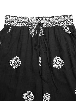 Black skirt with white embroidery on a white background