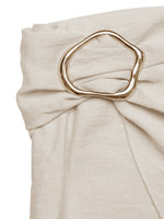 Beige fabric with a gold ring accent on a white background
