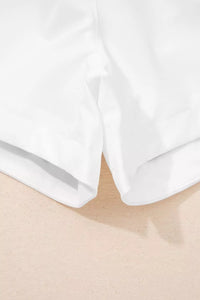 Close-up of white fabric on a beige surface