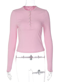 Pink long-sleeve shirt on a mannequin against a white background