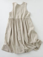 Beige sleeveless dress on a white background