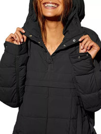 Person wearing a black puffer jacket with a hood on a white background