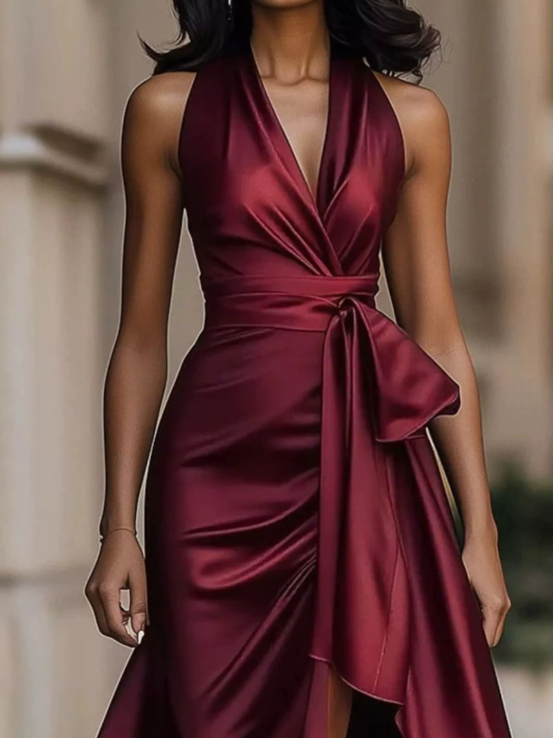 Maroon satin dress worn by a model with a blurred background