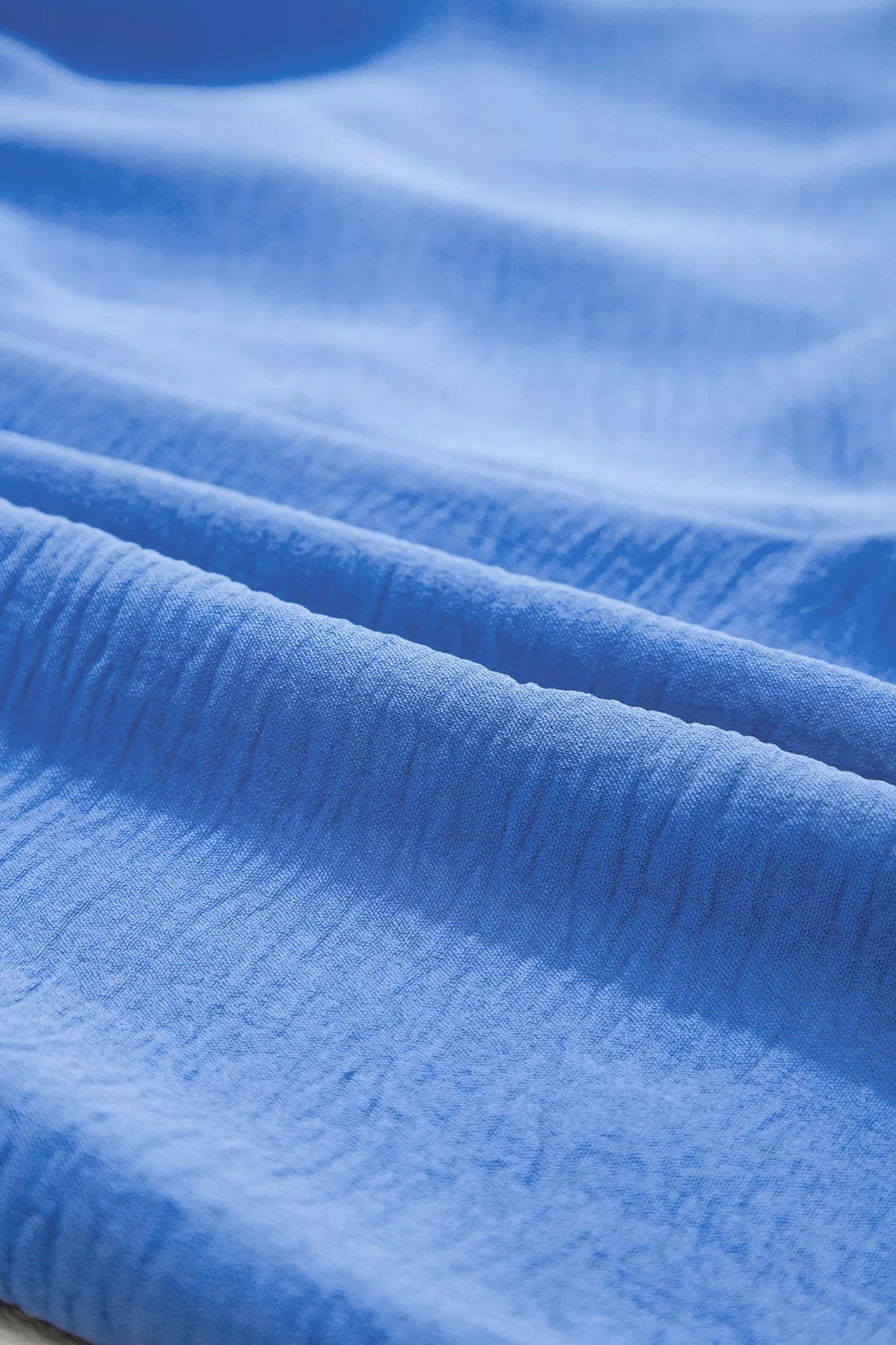 Close-up of blue fabric with visible texture