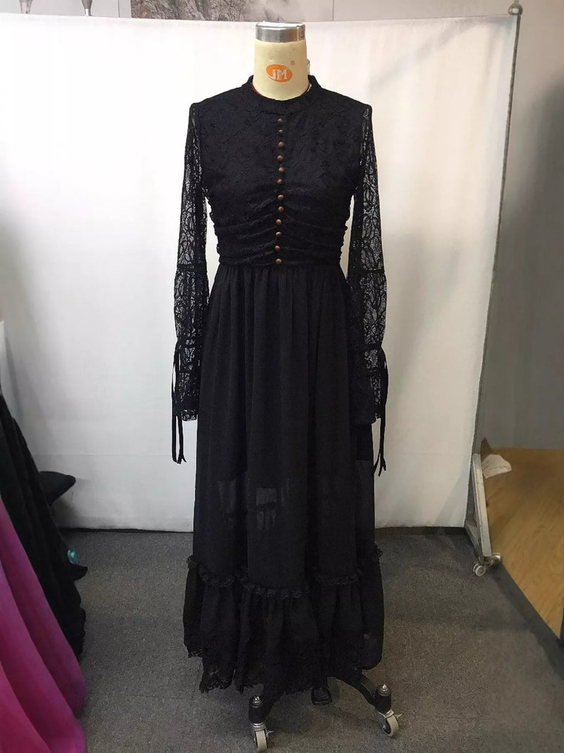 Black lace dress on a mannequin against a white backdrop